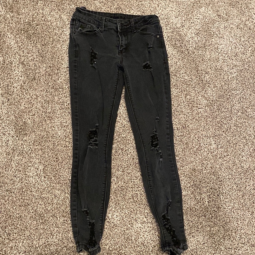 skinny ripped black jeans.
